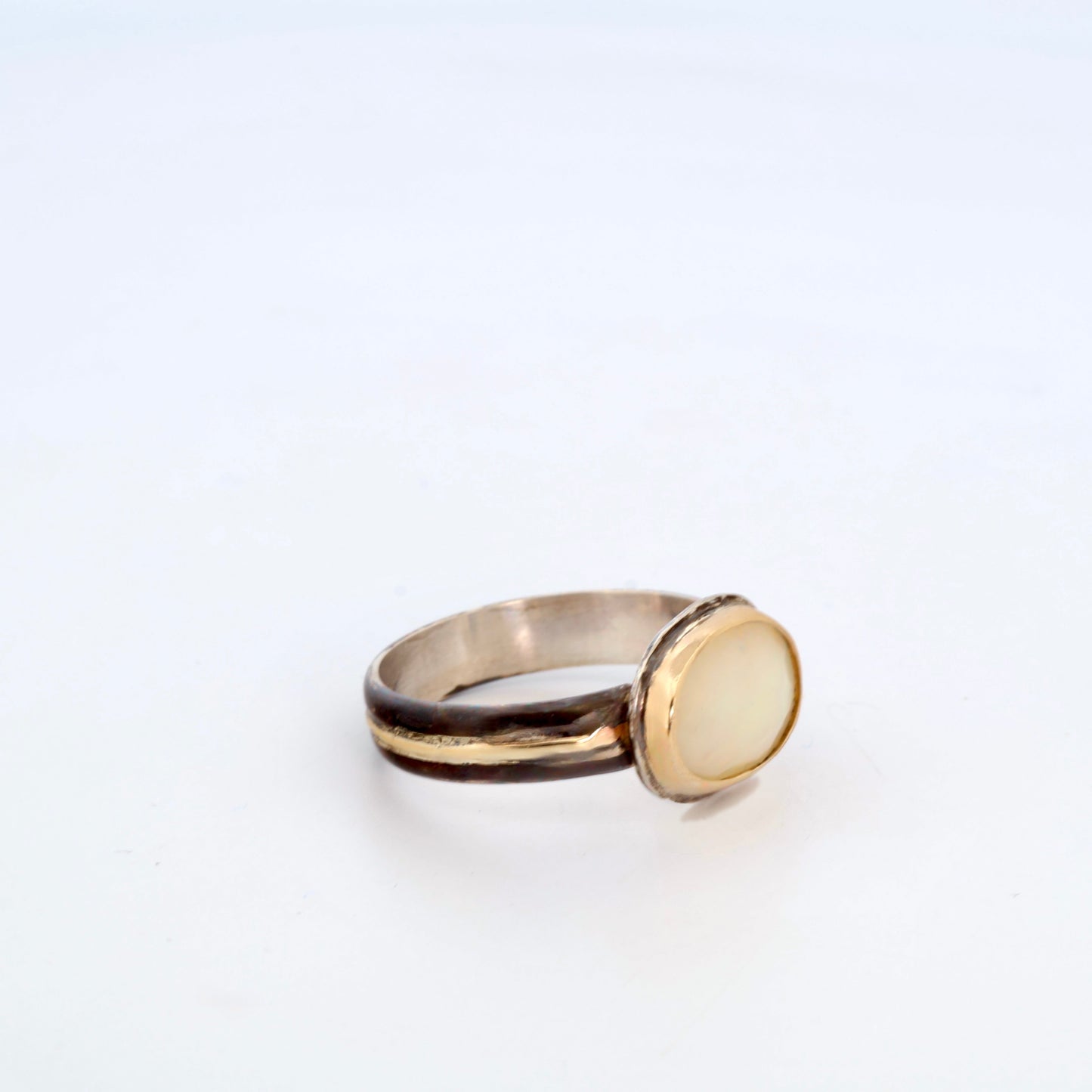 Rainbow White Opal Black and Gold Ring